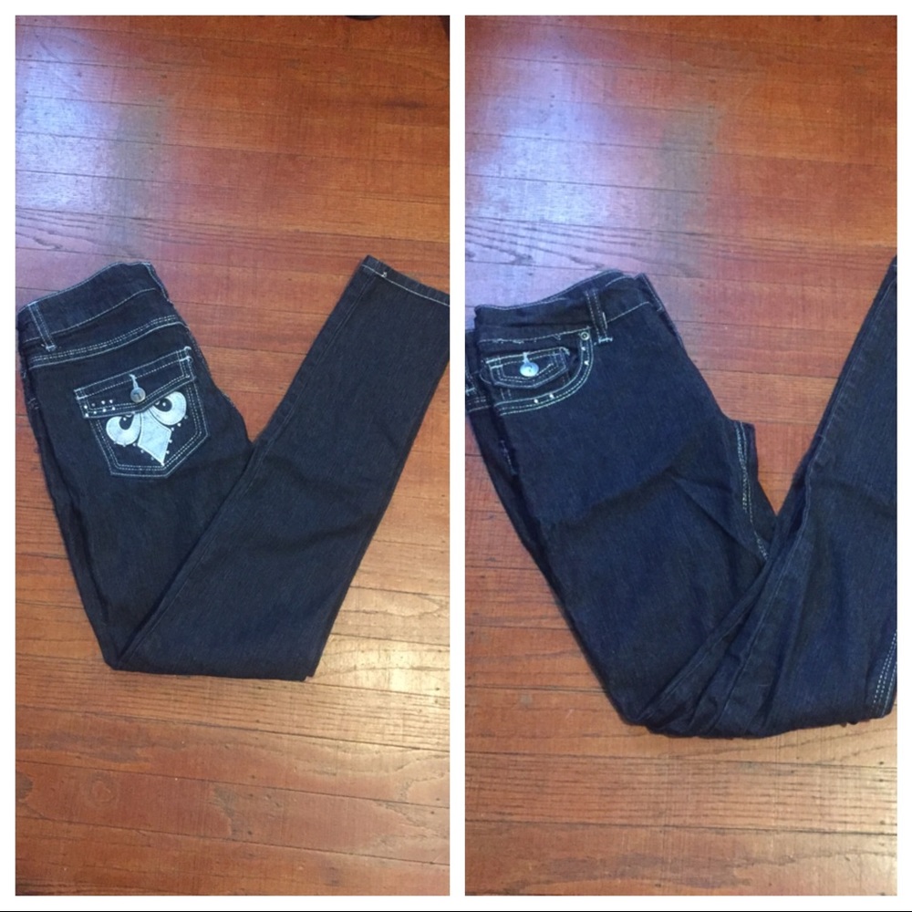 Black skinny jeans with silver Fleur de lis